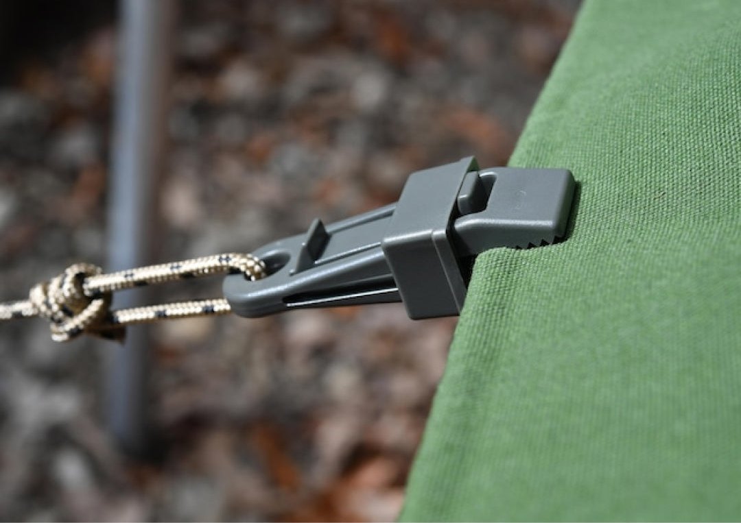 An OBORO clip gripping tent fabric without making a hole